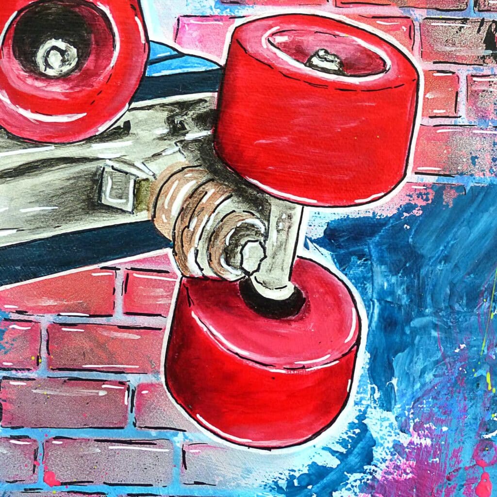 Détail des roues rouges du patin et de sa platine chromée, devant un mur de briques rose et bleu